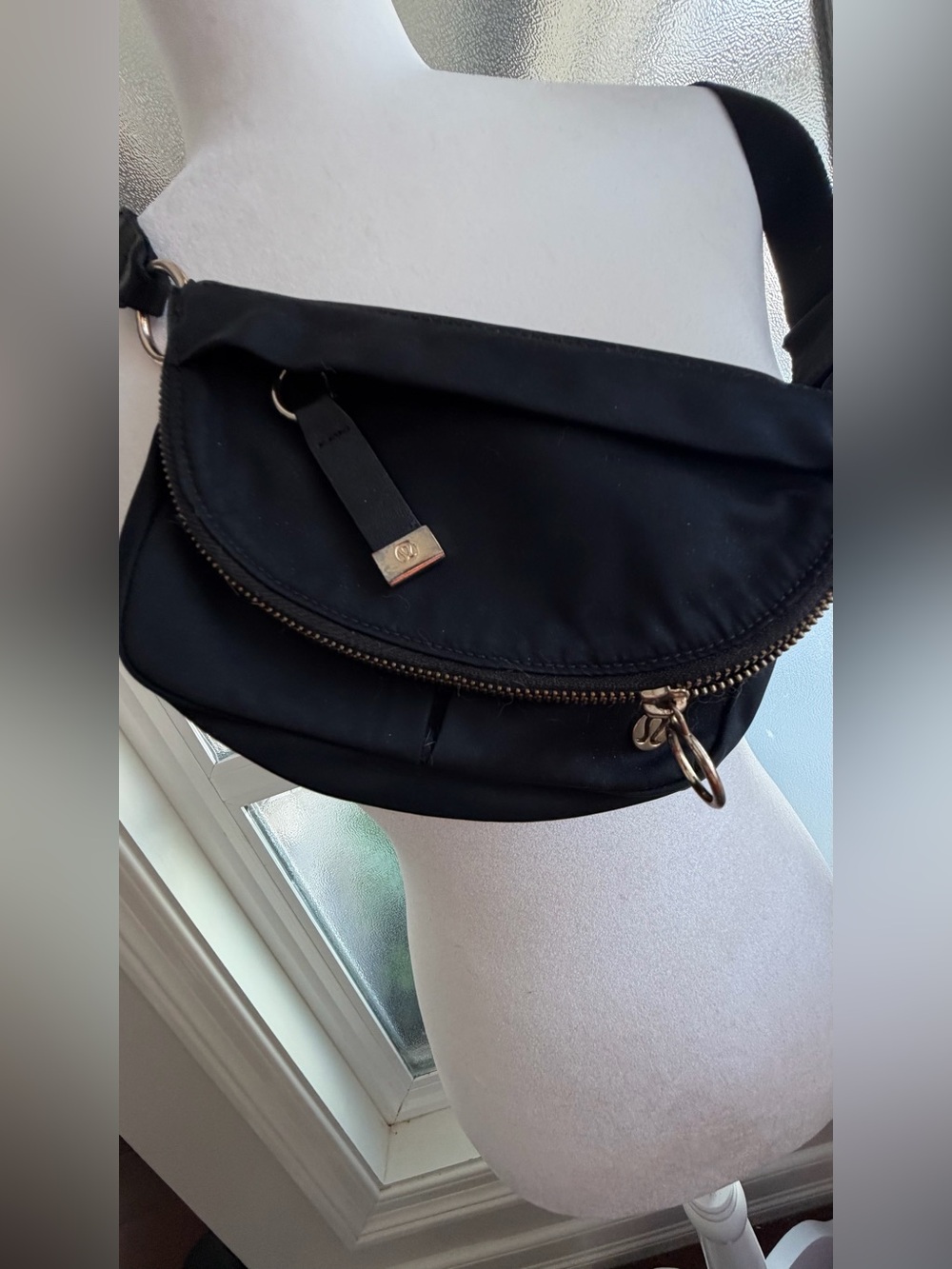 Lululemon Crossbody Bag with gold hardware.